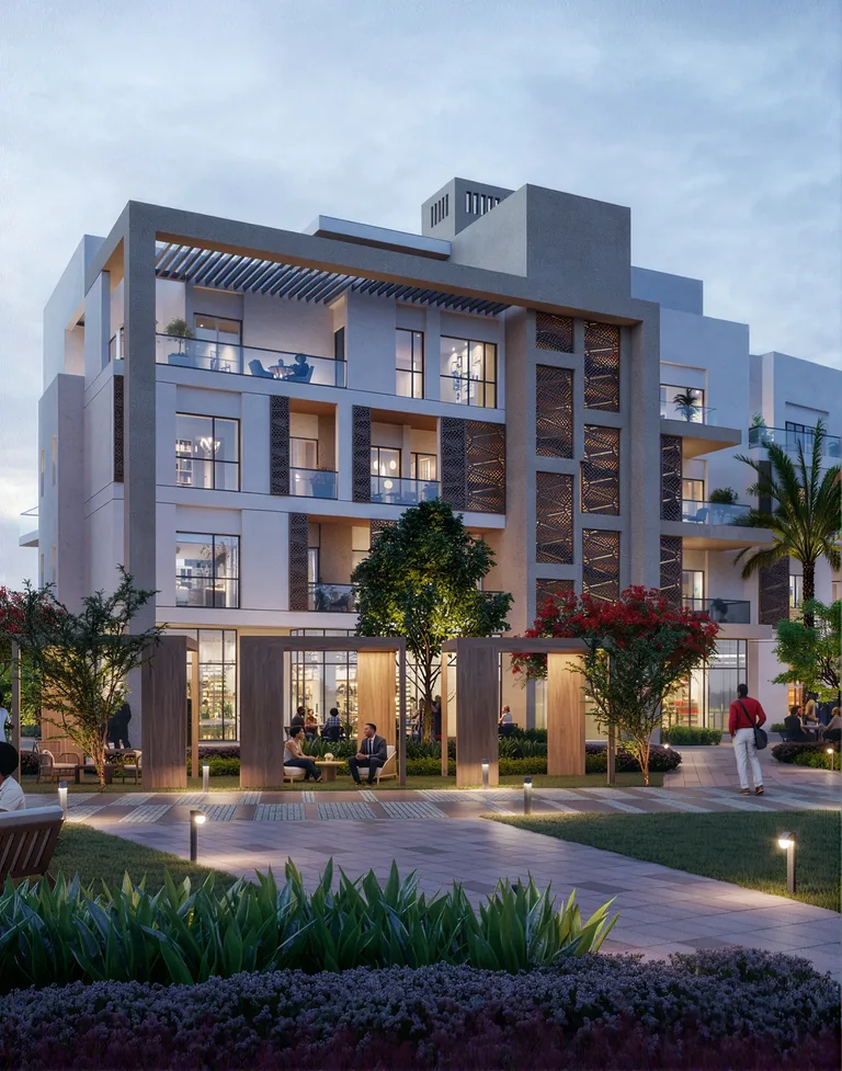 Facade of a white and brown building with nature around